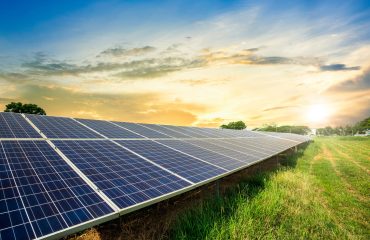 Solar panel cell on dramatic sunset sky background,clean Alternative power energy concept.